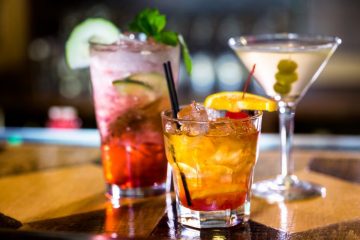 Three appealing cocktails on a bar