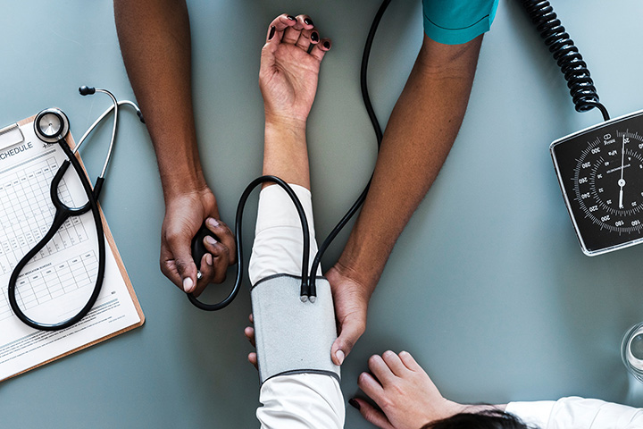 A person having their blood pressure measured